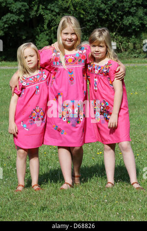 Dutch Princess Amalia (C) poses with her sisters Princess Ariane (L) and Princess Alexia for the media during a photo session at estate The Horsten in Wassenaar, The Netherlands, 7 July 2012. Prince Willem-Alexander lives with his family at Villa Eikenhorst at Estate the Horsten. Photo: Patrick van Katwijk / NETHERLANDS OUT Stock Photo