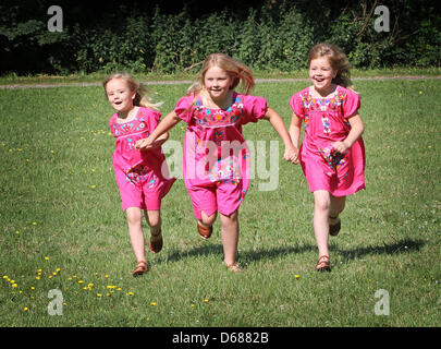 Dutch Princess Amalia (C) poses with her sisters Princess Ariane (L) and Princess Alexia for the media during a photo session at estate The Horsten in Wassenaar, The Netherlands, 7 July 2012. Prince Willem-Alexander lives with his family at Villa Eikenhorst at Estate the Horsten. Photo: Patrick van Katwijk / NETHERLANDS OUT Stock Photo