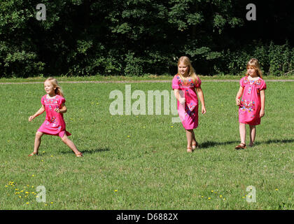 Dutch Princess Amalia (C) poses with her sisters Princess Ariane (L) and Princess Alexia for the media during a photo session at estate The Horsten in Wassenaar, The Netherlands, 7 July 2012. Prince Willem-Alexander lives with his family at Villa Eikenhorst at Estate the Horsten. Photo: Albert Nieboer / NETHERLANDS OUT Stock Photo