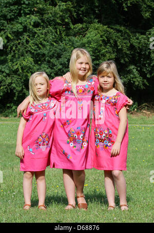 Dutch Princess Amalia (C) poses with her sisters Princess Ariane (L) and Princess Alexia for the media during a photo session at estate The Horsten in Wassenaar, The Netherlands, 7 July 2012. Prince Willem-Alexander lives with his family at Villa Eikenhorst at Estate the Horsten. Photo: Albert Nieboer / NETHERLANDS OUT Stock Photo
