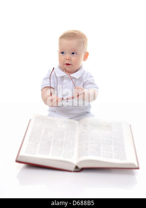 Little boy reads a big book Stock Photo