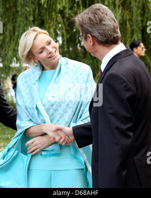 German Foreign Minister Guido Westerwelle and Princess Charlene of Monaco are ready to board the passenger ship Sanssouci outside the Chancellery in Berlin, Germany, 09 July 2012. Prince Albert II of Monaco and his wife visit Germany for several days. Photo: STEPHANIE PILLICK Stock Photo