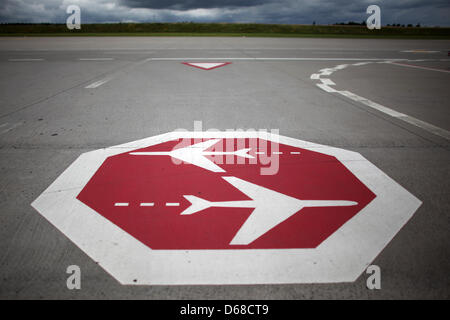 A sign placed on the runway of the airport Frankfurt-Hahn warns pilots and passengers of crossing airplanes in Lautzenhausen, Germany, 11 July 2012. Photo: Fredrik von Erichsen Stock Photo