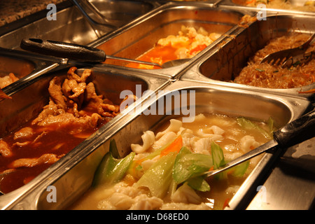steel tray filled with food inside the self service Chinese restaurant Stock Photo