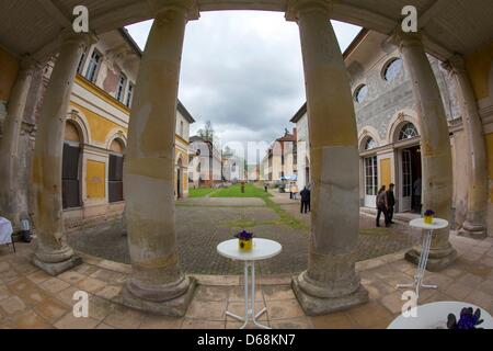 FILE - An archive picture dated 09 May 2012 shows visitors walking through the palace complex Wilhelmsthal near Eisenach, Germany, 09 May 2012. After years of deterioration the Palace, Castle and Garden Trust of Thuringia has now completed the first stage of restauring the palace. 2.5 million euros were spent on renewing the roof timbers of the old palace and repaiting sponge damag Stock Photo