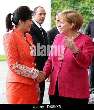 German Chancellor Angela Merkel (CDU, R) receives Thai Prime Minister Yingluck Shinawatra at the Federal Chancellery in Berlin, Germany, 18 July 2012. The guest from Thailand will be in Germany for several days. Photo: WOLFGANG KUMM Stock Photo