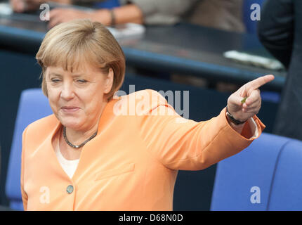 German Chancellor Angela Merkel (CDU) gestures at the start of the special session of the Bundestag in Berlin, Germany, 19 July 2012. Parliament will vote on helping Spanish banks with a credit of billions of euros from the ESFS. Photo: WOLFGANG KUMM Stock Photo