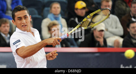 Spanish tennis player Nicolas Almagro hits the ball during a match against Dawydenko from from Russia at the ATP World Tour 500 tournament at Rothenbaum in Hamburg, Germany, 19 July 2012. Photo: ANGELIKA WARMUTH Stock Photo