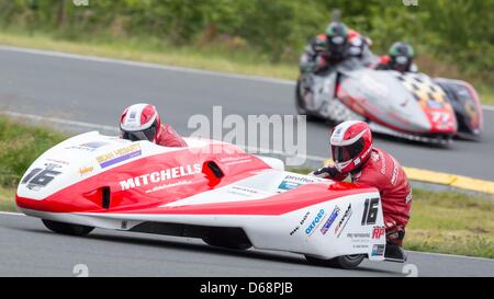 Ben and Thomas Birchall (GB) take off from the pit after a tire change during the first time training of the Sidecar World Championship at the Schleizer Dreieck in Schleiz, Germany, 20 July 2012. The former world champions are currently in third place and are hoping for gold during the race on Sunday. Photo: Michael Reichel Stock Photo