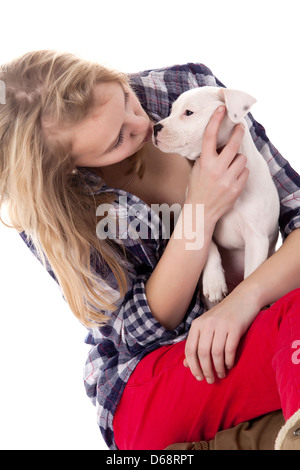 Young girl having a great time with the puppies Stock Photo