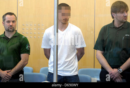 NEW! Defendant Amid C. appears in court in Duesseldorf, Germany, 25 July 2012. A trial against four alleged al-Qaeda terrorists has begun under most stringent safety precautions. The men are accused of planning a terror attack in Germany. Photo: FEDERICO GAMBARINI Stock Photo