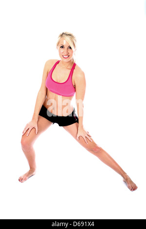 Positive Healthy Young Blonde Woman, Wearing Pink Crop Top, Black Shorts, Performing Fitness Floor Exercises, Isolated White Background, Clipping Path Stock Photo