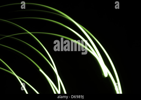 This creative light painting photograph features dynamic and abstract lighting, with random colors and patterns formed through long exposure techniques. Stock Photo