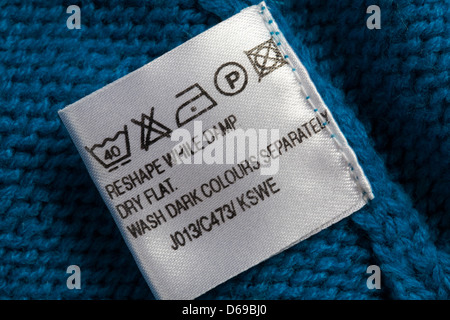 label showing washing instructions in garment - care washing symbols and instructions Stock Photo