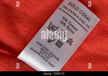 label showing washing instructions in garment - care washing symbols and instructions Stock Photo