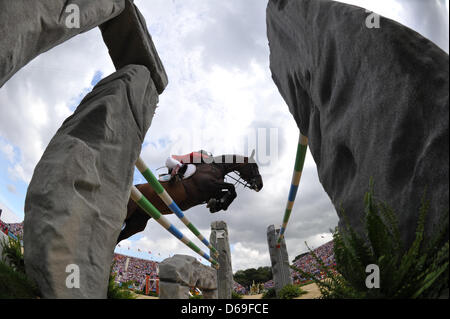 Germany's jumping rider Meredith Michaels-Beerbaum jumps with her horse Bella Donna an obstacle in the London 2012 olympic jumping competition at Greenwich Park in London, Britain, 08 August 2012. Photo: Jochen Luebke dpa  +++(c) dpa - Bildfunk+++ Stock Photo