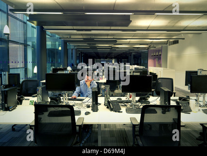 Businessman working late in office Stock Photo