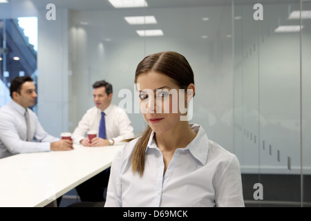 Businesswoman sitting in meeting room Stock Photo