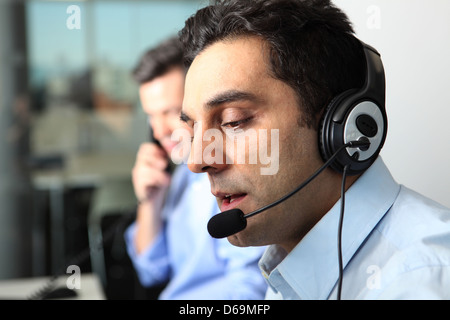 Businessman talking on headset Stock Photo