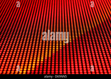 Rows of LEDs showing red light. Shallow depth of field for a blurred effect. Stock Photo