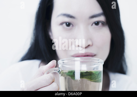 Woman having cup of tea Stock Photo