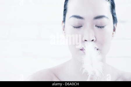 Woman breathing in powder Stock Photo