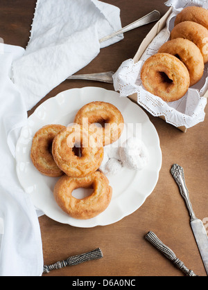 Plate of donuts on table Stock Photo