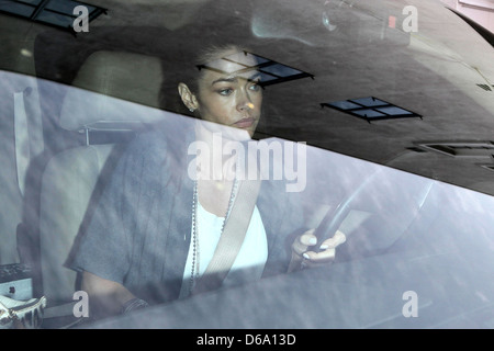 Denise Richards driving out of a parking garage in Beverly Hills on the day her ex-husband was fired from his hit sitcom 'Two Stock Photo