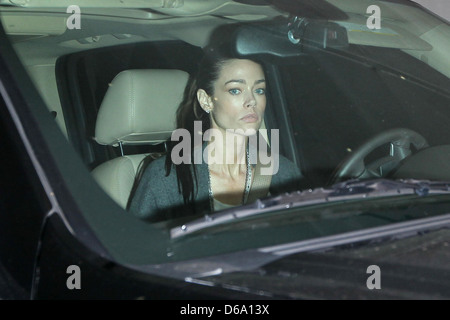 Denise Richards driving out of a parking garage in Beverly Hills, on the day her ex-husband was fired from his hit sitcom 'Two Stock Photo