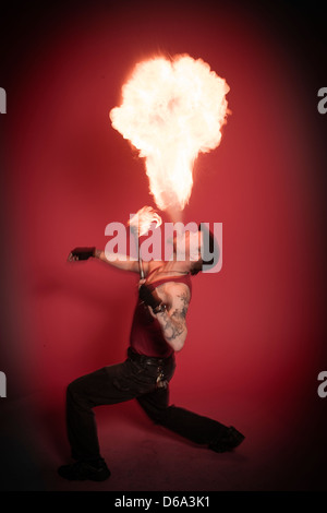 Fire breather performing Stock Photo