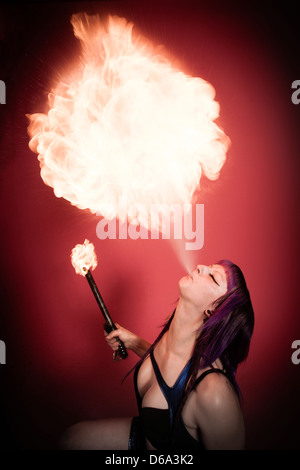 Fire breather performing Stock Photo