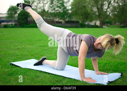 middle aged woman exercising Stock Photo