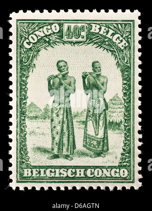 Postage stamp from the Belgian Congo depicting native men playing instruments. Stock Photo