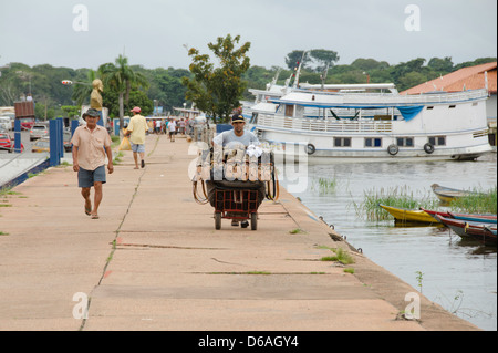 Brazil, Amazonas, Rio Tapajos, Santarem. Waterfront shoe vendor. Stock Photo