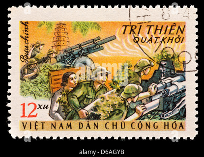 Postage stamp from North Vietnam depicting gun crews manning their weapons. Stock Photo