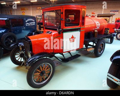 The 1919 Ford Model TT Tankwagen is a tanker truck variant of the Model TT, featuring a 201 cu in inline four-cylinder engine producing 20 horsepower. Designed for transporting liquids, it has a top speed of approximately 55 km/h. This model is part of the Canadian Automotive Museum collection. Stock Photo
