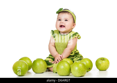 happy baby girl with green apples isolated on white background Stock Photo