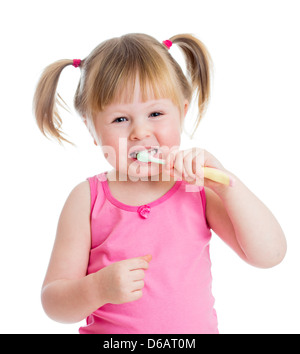 baby cleaning teeth and smiling, isolated on white background Stock Photo