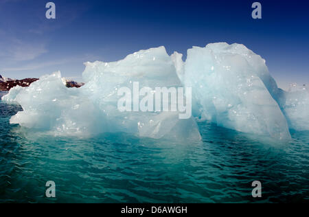 View of icebergs in the Sermilik Fjord near Tiniteqilaaq on Greenland, Denmark, 17 July 2012. Photo: Patrick Pleul Stock Photo