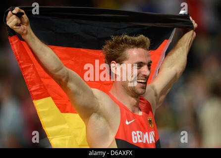 Bjoern Otto of Germany celebrates after winning the silver medal in the Men's Pole Vault final of the London 2012 Olympic Games Athletics, Track and Field events at the Olympic Stadium, London, Great Britain, 10 August 2012. Photo: Marius Becker dpa  +++(c) dpa - Bildfunk+++ Stock Photo