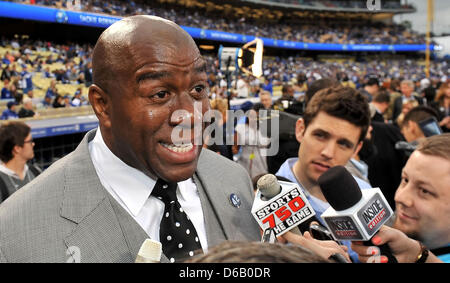 Los Angeles, CA. USA. April 15, 2013 Los Angeles Dodgers Co-owner Earvin Magic Johnson is interviewed on the field before the Major League Baseball game between the Los Angeles Dodgers and the San Diego Padres at Dodger Stadium as Jackie Robinson Day is celebrated as every player wears the number 42 to honor former Los Angeles Dodgers freat Jackie Robinson..The San Diego Padres defeat the Los Angeles Dodgers 6-3.Louis Lopez/CSM/Alamy Live News Stock Photo