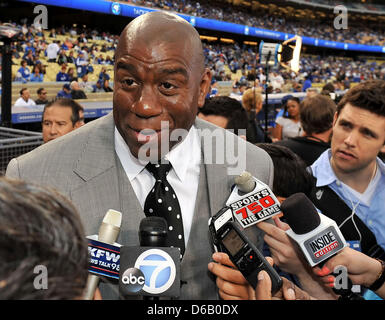 Los Angeles, CA. USA. April 15, 2013 Los Angeles Dodgers Co-owner Earvin Magic Johnson is interviewed on the field before the Major League Baseball game between the Los Angeles Dodgers and the San Diego Padres at Dodger Stadium as Jackie Robinson Day is celebrated as every player wears the number 42 to honor former Los Angeles Dodgers freat Jackie Robinson..The San Diego Padres defeat the Los Angeles Dodgers 6-3.Louis Lopez/CSM/Alamy Live News Stock Photo