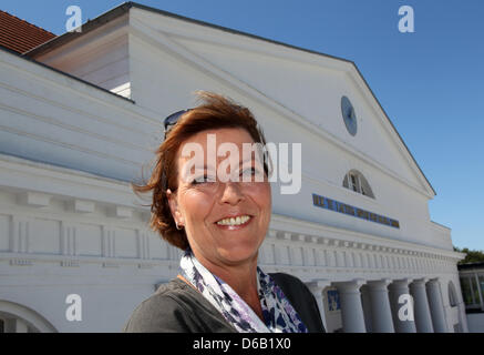 Christine Neubauer poses during a press sessioin during filming for the movie of the best seller by Dora Heldt, 'Bei Hitze ist es wenigstens nicht kalt' ('In the heat, at least its not cold'), at the Grand Hotel in Heiligendamm, Germany, 14 August 2012. The movie tells the story of Doris Goldstein-Wagner (Christine Neubauer), who travel to the hotel on the Baltic Sea for a suprise  Stock Photo