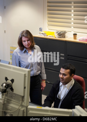 Business people talking at desk Stock Photo