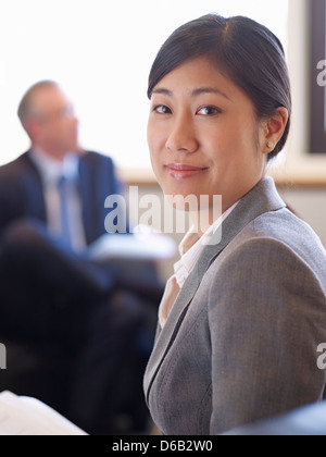 Businesswoman smiling in office Stock Photo