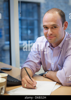 Businessman working at desk Stock Photo