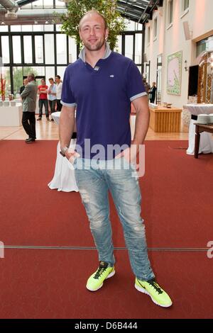 Olympic discus throwing champion Robert Harting arrives at the official reception for the Berlin Olympic competitors in Berlin, Germany, 16 August 2012. Numerous athletes were honoured once more for their achievements in the German capital. Photo: Robert Schlesinger Stock Photo