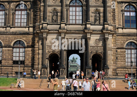 Tourists walk to the Semper Gallery at the Zwinger in Dresden, Germany, 22 August 2012. The building completed in 1855 houses the Old Masters Picture Gallery. It was renovated between 1989 and 1992, but experts have found numerous localized damages. The museum will have to be closed from 14 January until 26 March 2013. Afterwards, it will be gradually restored while the museum will Stock Photo