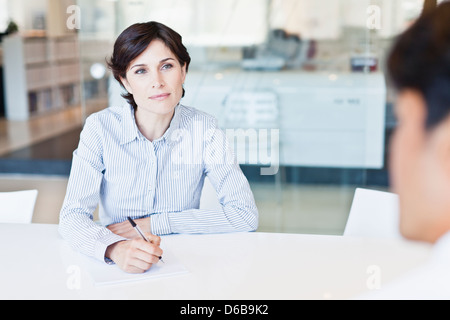 Business people talking at desk Stock Photo