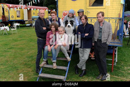 German actors Peter Lohmeyer (L-R) , Valeria Eisenbart, Quirin Oettl, Neele-Marie Nickel, Justus Schlingensiepen, Kristo Ferkic, Oliver Korittke, director Mike Marzuk and Stefan Konarske pose for a photo on the set of the film 'Fuenf Freunde 2 (Five Friends 2) with dog Coffey in Eckernfoerde, Germany, 24 August 2012. The film shall be featured in German cinemas in January 2013. Pho Stock Photo